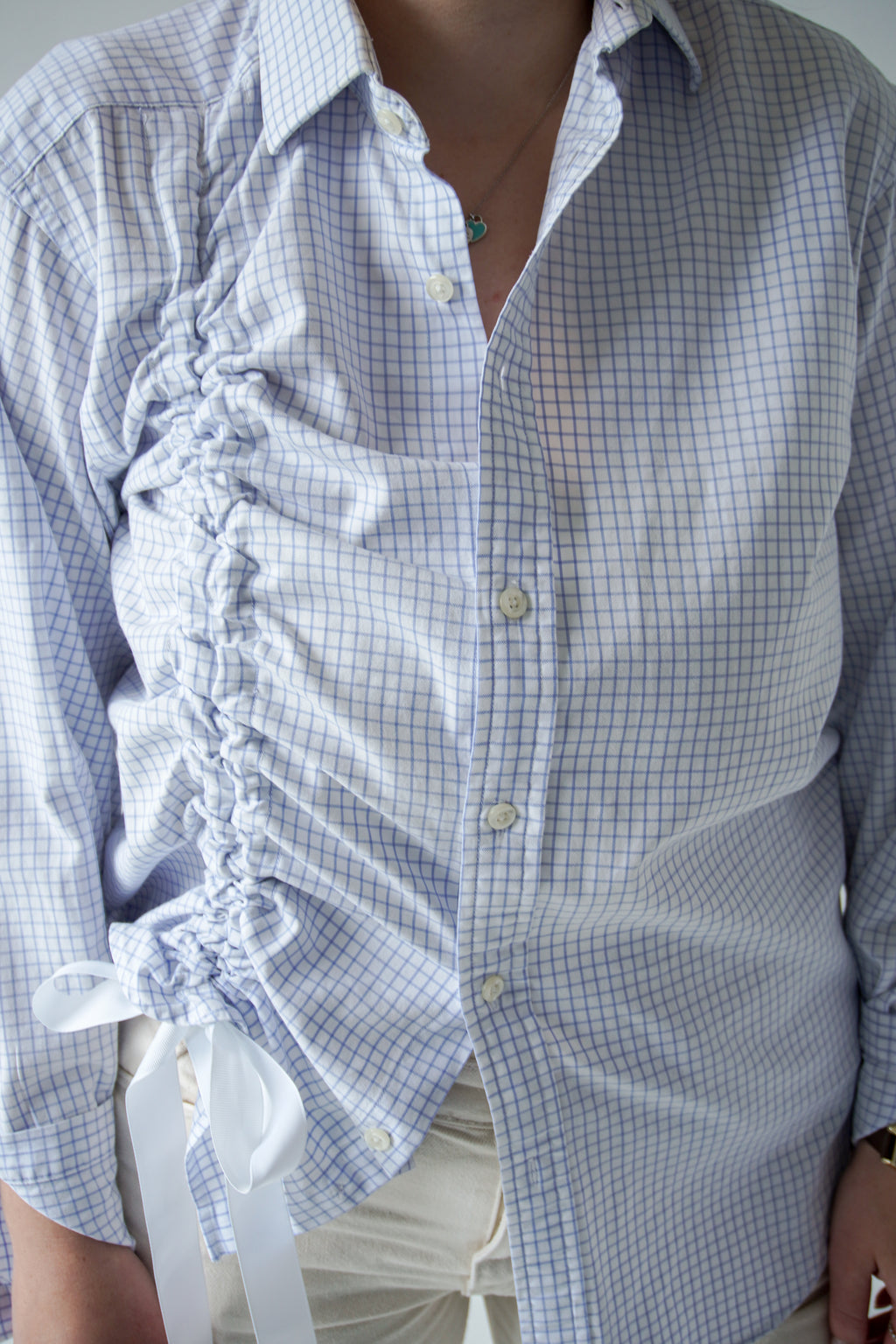 Blue shirt with asymmetrical drawstring