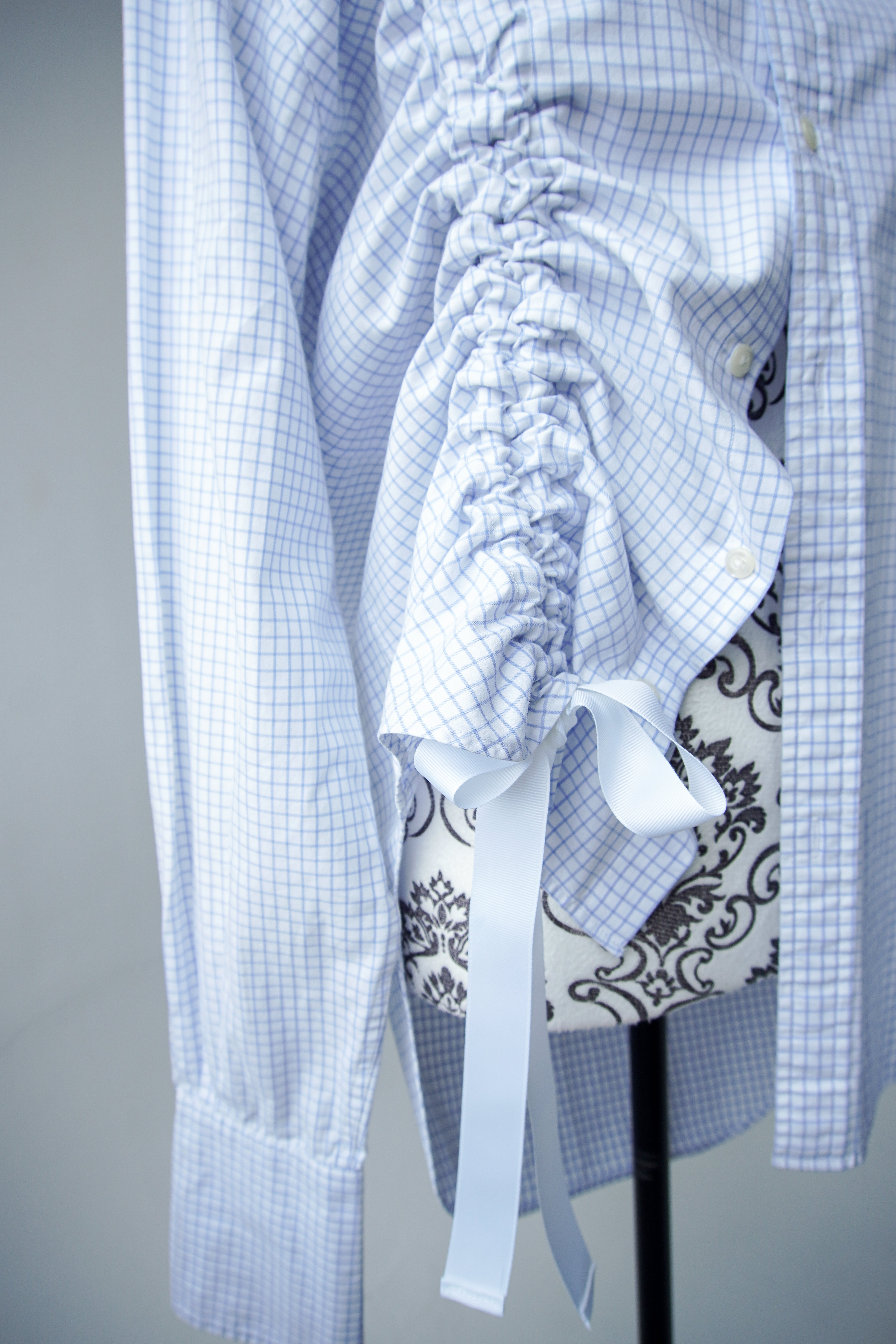 Blue shirt with asymmetrical drawstring